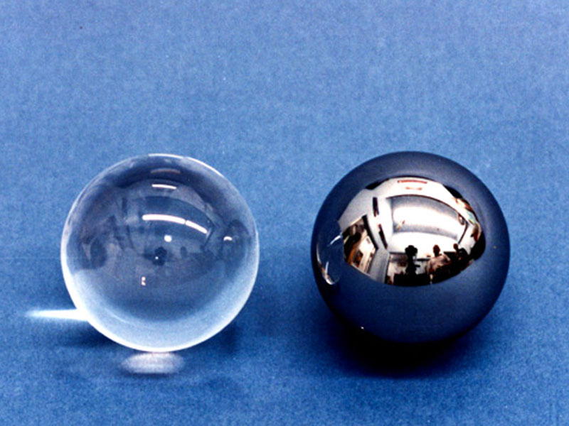 Gyro  rotors-uncoated fused quartz (left) and caoted with niobium (right)